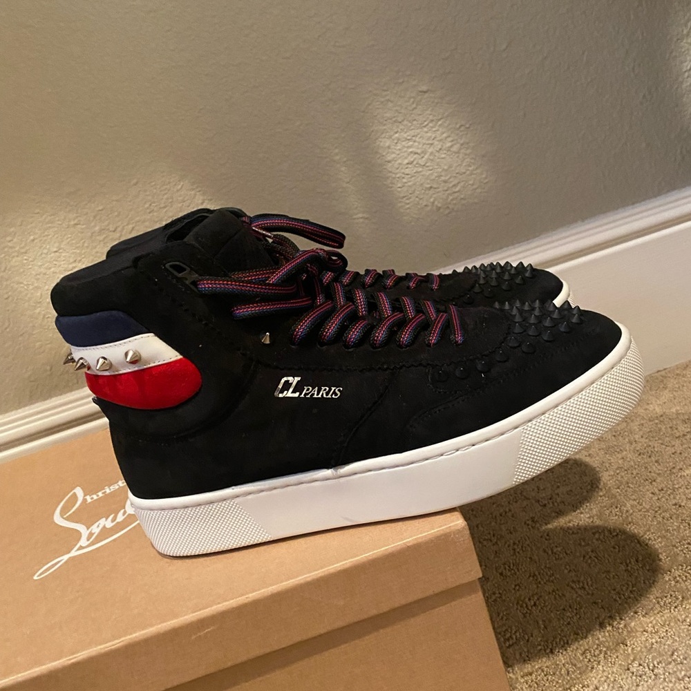Red white & black studded Christian Louboutin sneakers